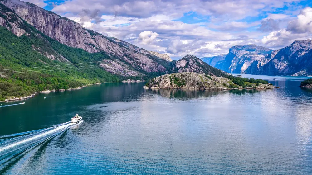 wide angle view of boat in norway fjords.